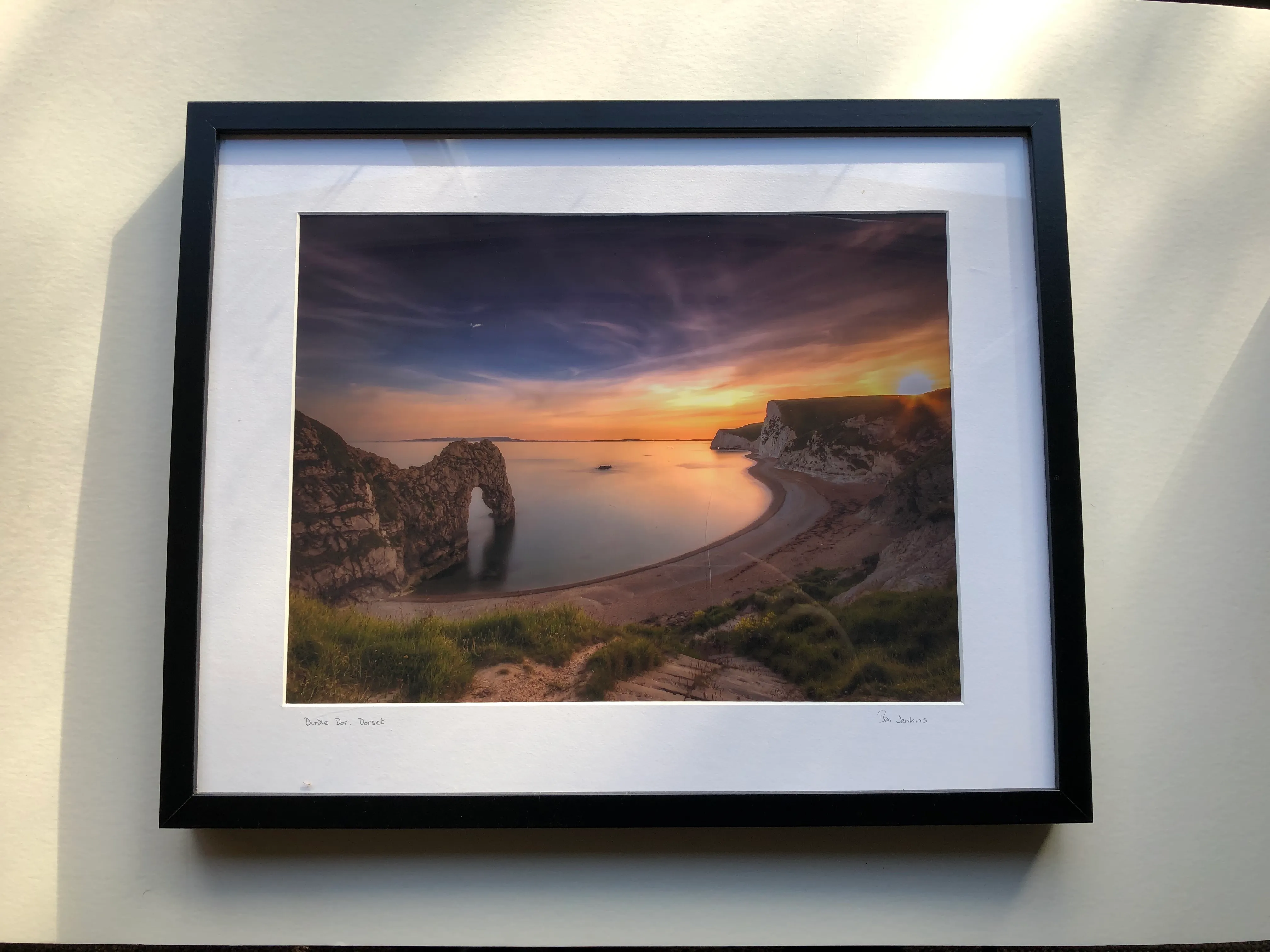 Framed and mounted photograph of Durdle Door at sunset